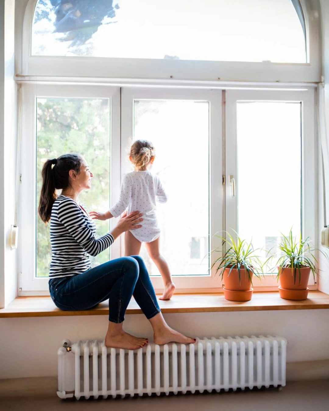 Homeowners reviewing financing options for an impact window and door project